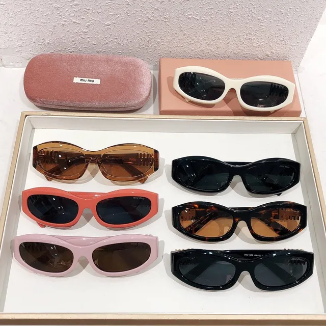 Miu Miu Orange Black Oval Acetate Frame Embossed Logo Temples Sunglasses 2