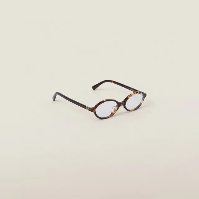 Miu Miu SMU04Z Lunettes de soleil ovales en acétate crème 3
