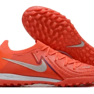 Nike Zapatillas de fútbol turf naranja y plata low-cut upper de knit studs cónicos