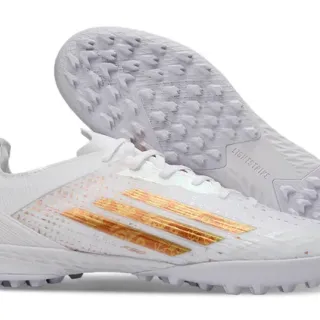 Adidas Zapatos de fútbol turf low-cut con upper de malla sintética blanco y oro