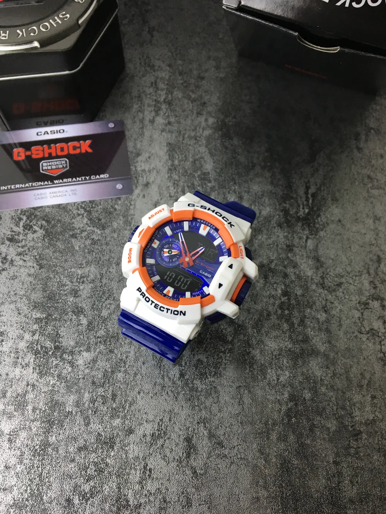 Casio G-Shock GA-100 Montre Sportive Bleue Blanche Orange 2