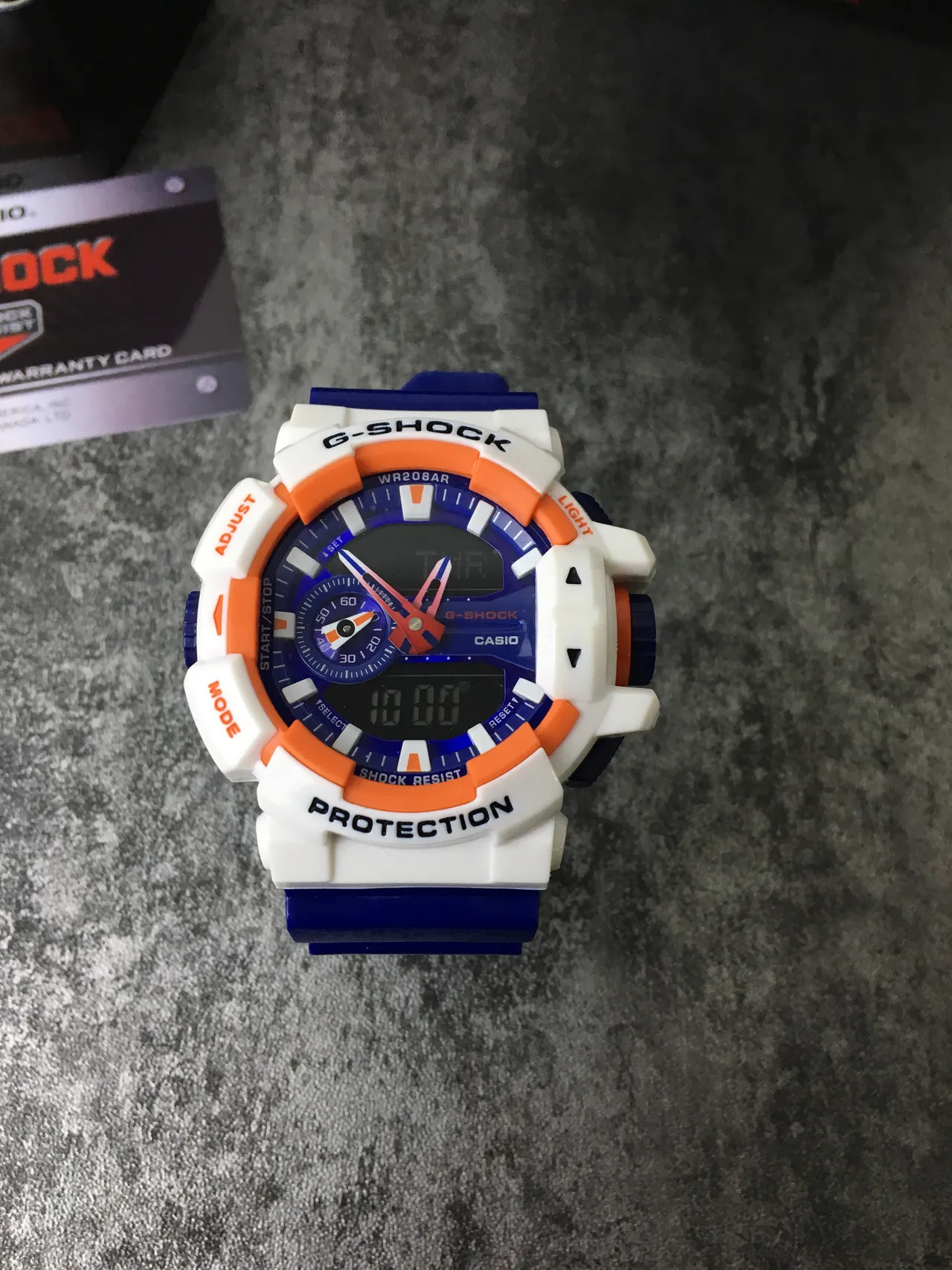 Casio G-Shock GA-100 Montre Sportive Bleue Blanche Orange 3