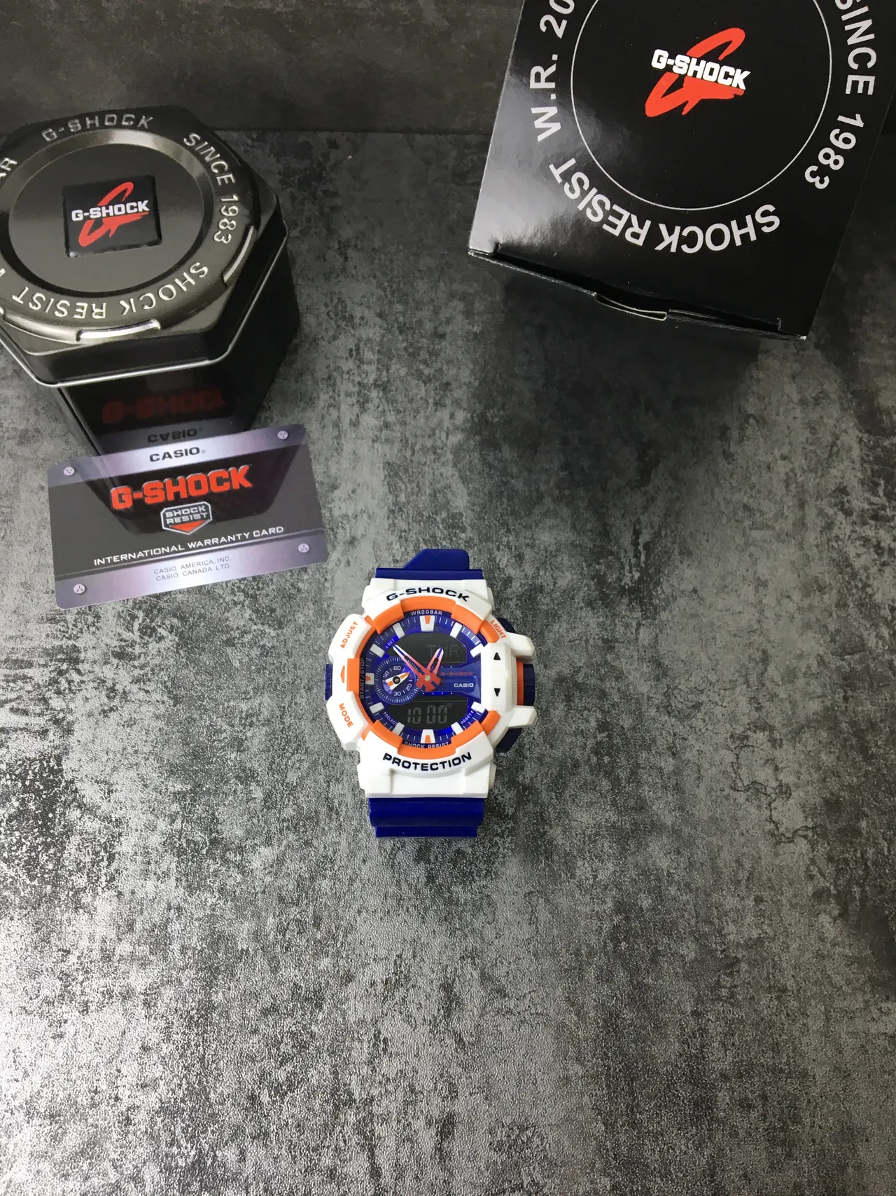 Casio G-Shock GA-100 Montre Sportive Bleue Blanche Orange 4