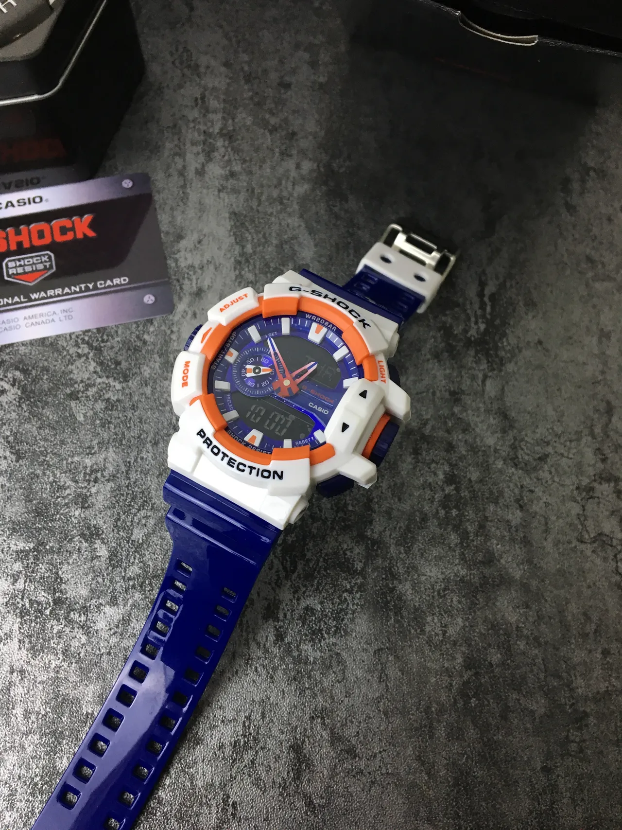 Casio G-Shock GA-100 Montre Sportive Bleue Blanche Orange 7