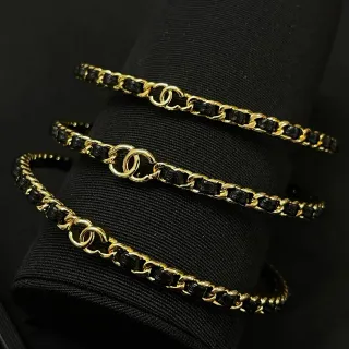 Chanel CC Bracelet Gold-Tone and Black Woven Chain Bracelets