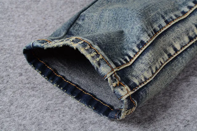 Jeans bleus distressed moto-panelled avec poche zip 3