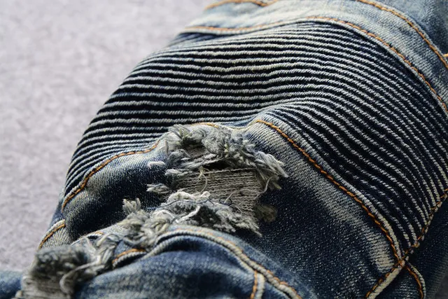 Jeans bleus distressed moto-panelled avec poche zip 9