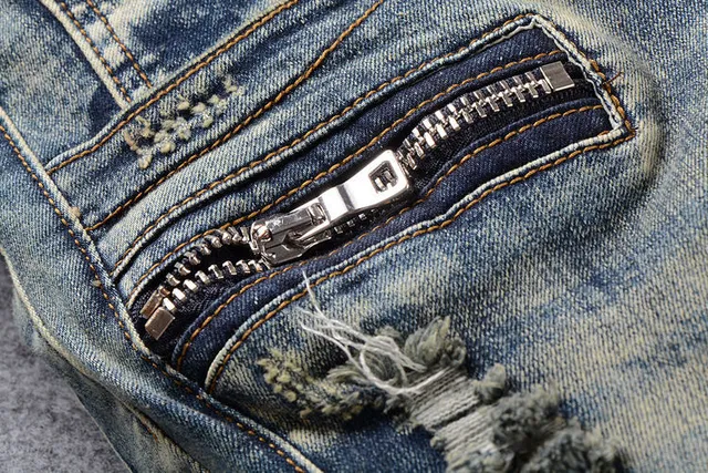 Jeans bleus distressed moto-panelled avec poche zip 10
