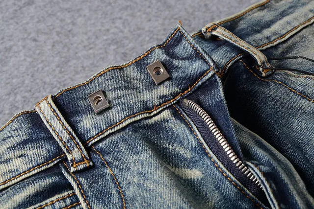 Jeans bleus distressed moto-panelled avec poche zip 14