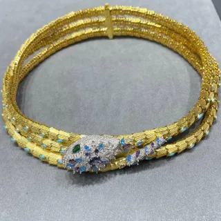 Collier multi-brins tête de serpent en gemmes ton doré