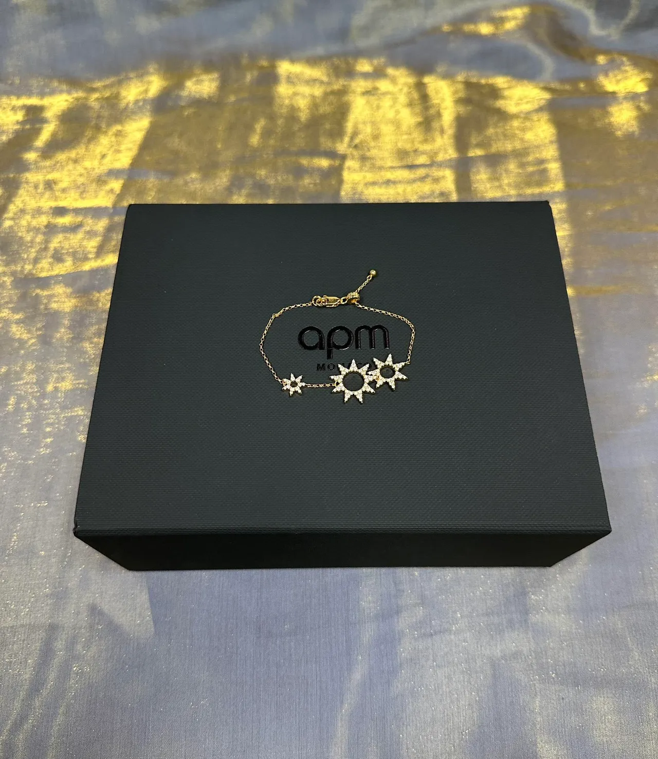 Bracelet en chaîne avec motif étoile éclatante en ton doré 4