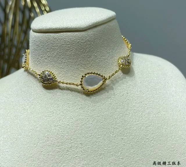 Gold-Tone Three-Link Oval Stone and Crystal Bracelet 6