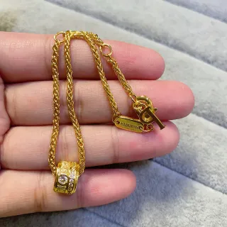 Collier pendentif chaîne en corde tressée en or cylindrique pavé-set