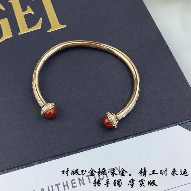 Piaget Possession Gold and Red Cabochon Rotating Cuff Bracelet 6