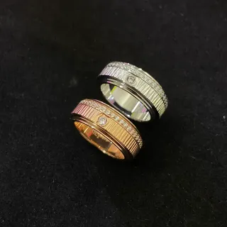 Anillos de diamantes pavé de dos tonos con banda giratoria surcada