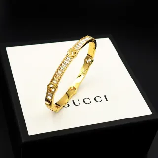 Gucci Gold-Tone Baguette Crystal Interlocking G Bangle Bracelet