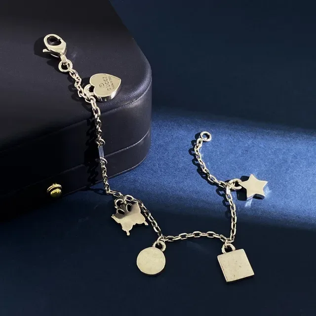 Gucci Multi-Charm Silver-Tone Engraved Logo Bracelet 5