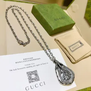 Gucci collier pendentif oiseau motif goutte en argent