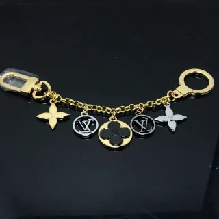 Louis Vuitton Cadena de oro y negra con múltiples colgantes pulsera