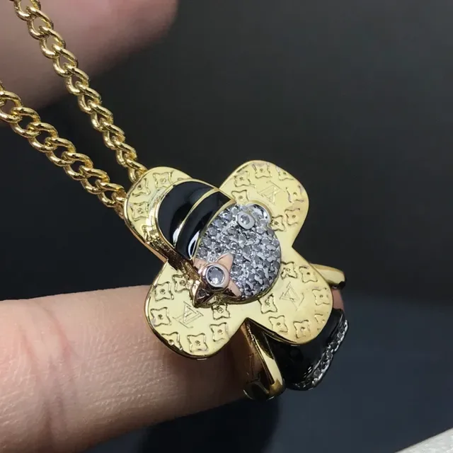 Louis Vuitton Gold Black Monogram-Engraved Clover-Shaped Necklace 3