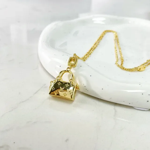 Louis Vuitton Gold Monogrammed Necklace 3
