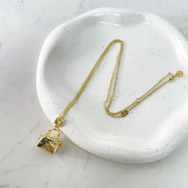 Louis Vuitton Gold Monogrammed Necklace 4