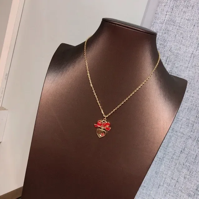 Louis Vuitton Monogram Bow Heart Enamel Necklace 4