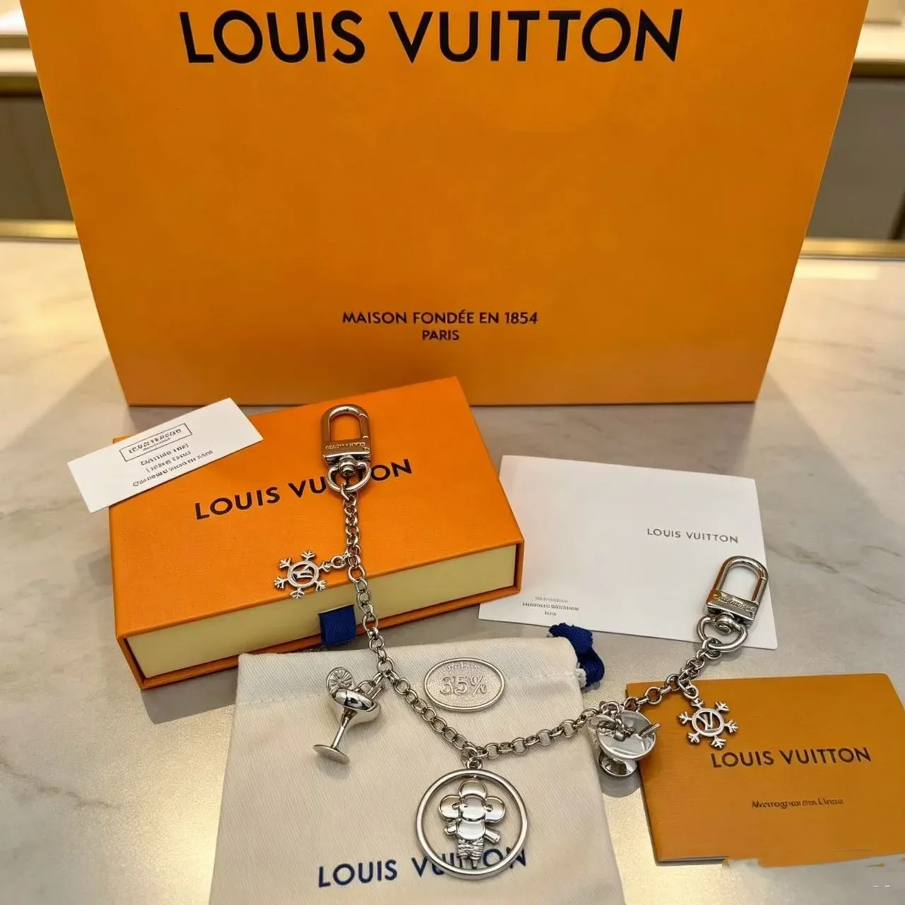 Louis Vuitton मल्टी-चार्म गोल्ड सिल्वर डुअल-टोन मेटल ब्रेसलेट 4