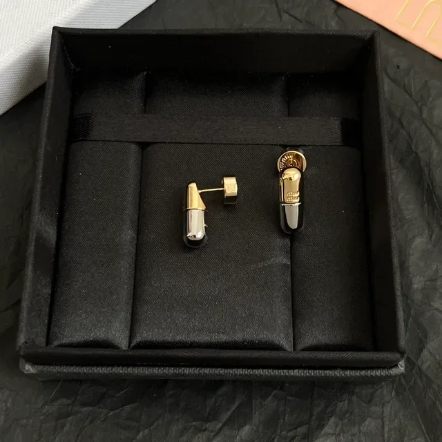 Miu Miu Boucles d'oreilles dorées argent en forme de capsule bicolores métalliques 2