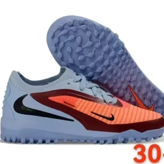 Nike Zapatillas de fútbol turf azul y naranja low-cut con upper knit y sintético