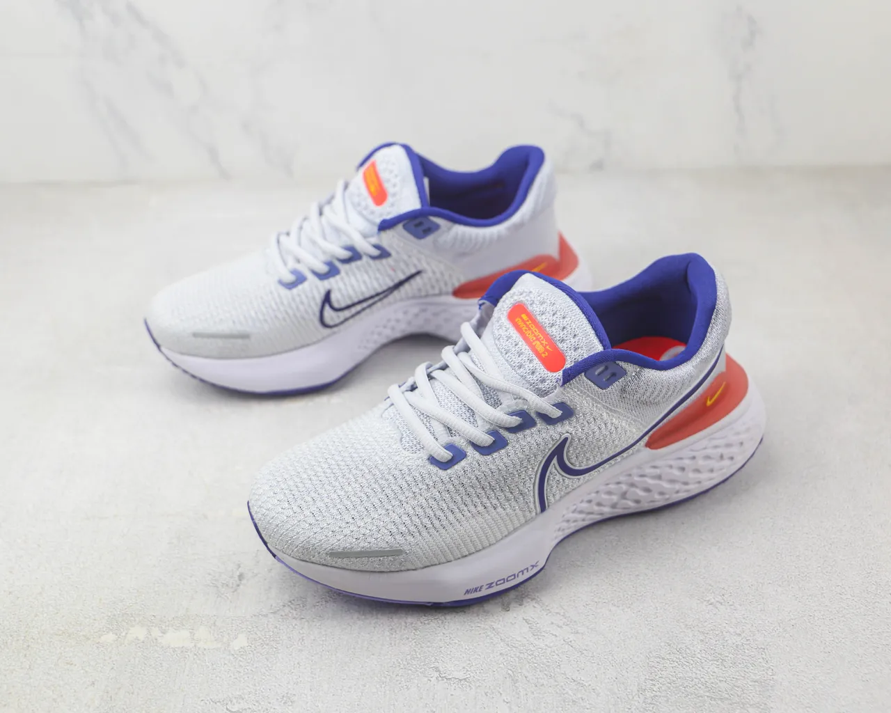 Nike ZoomX Invincible Run Tênis de corrida com upper de knit cinza azul, sola intermediária esculturada ondulada 4