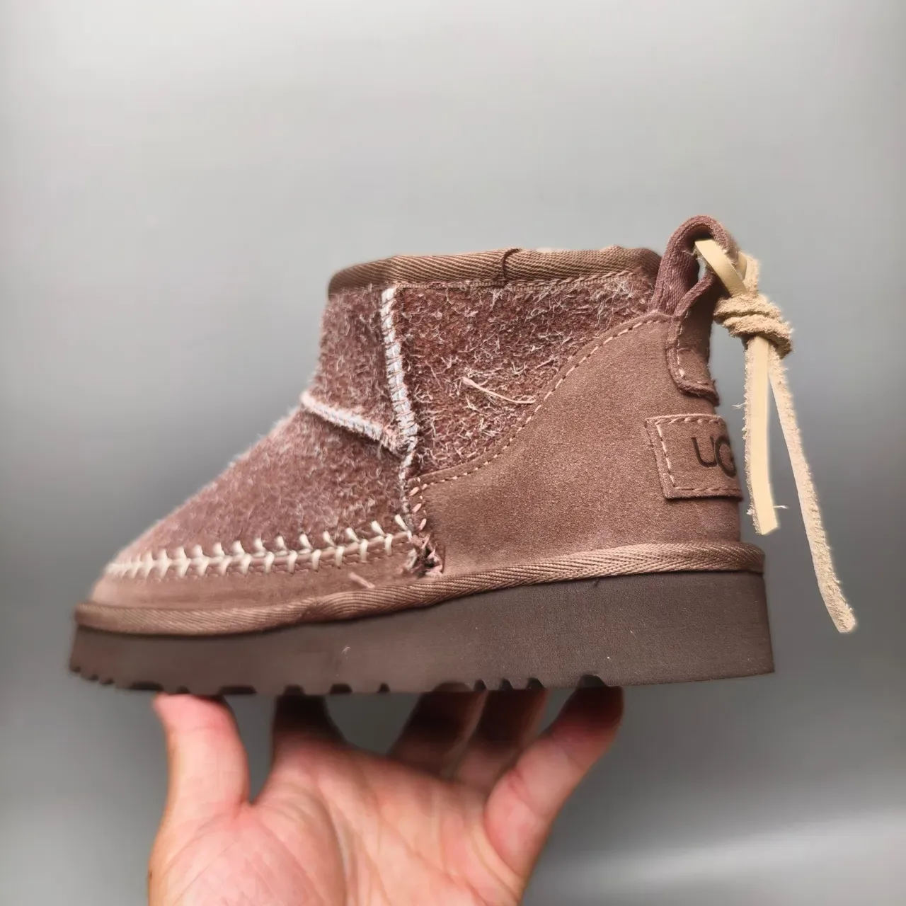 UGG Tasman বাদামী শিয়ারলিং লাইন্ড সুয়েড স্নো বুট 4