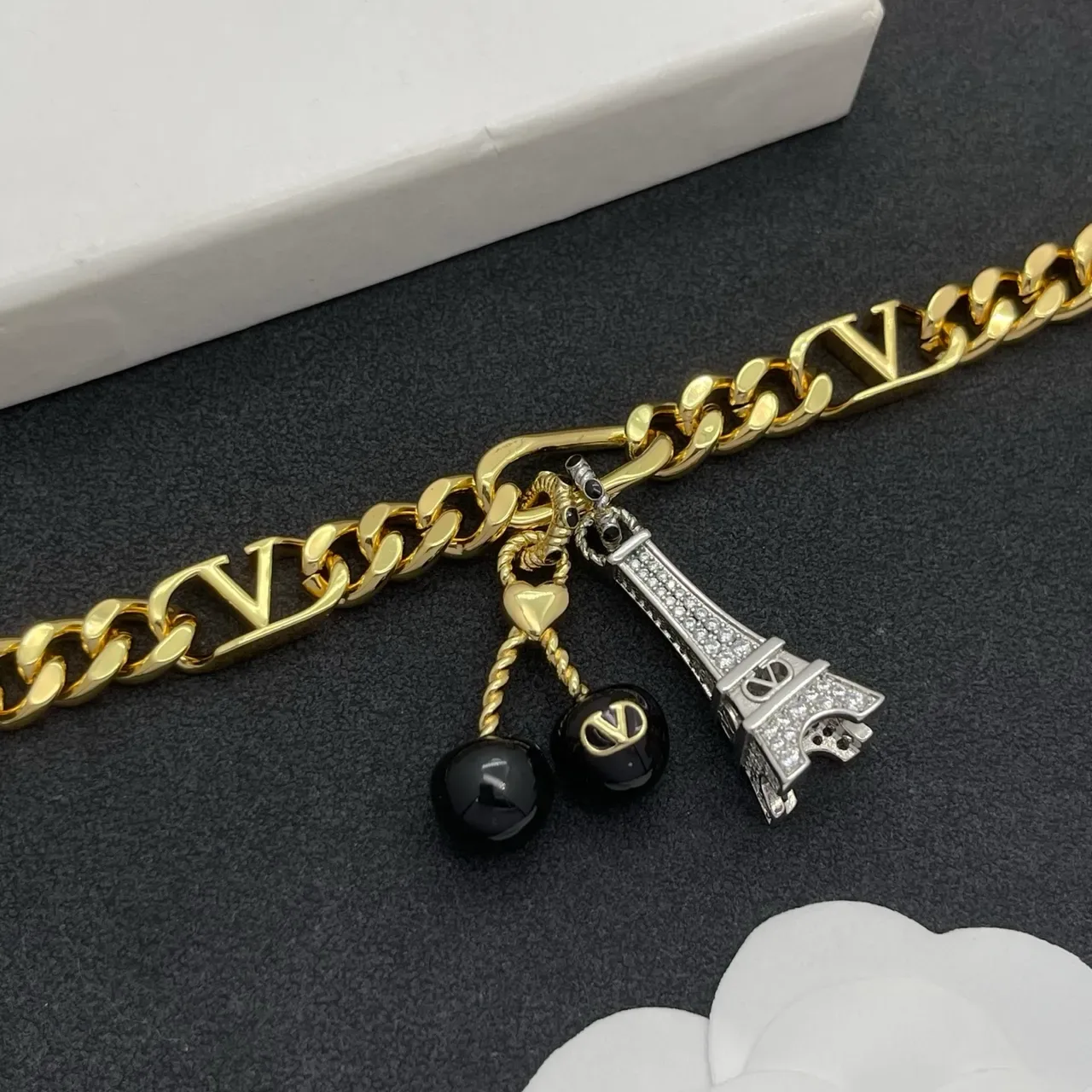 Valentino VLogo Or Noir Figaro Chain Motif Bracelet 7