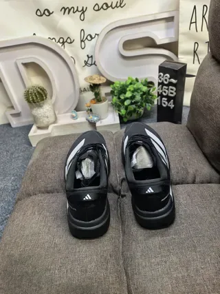 Adidas Black and Silver Three-Stripe Lifestyle Sneakers 8
