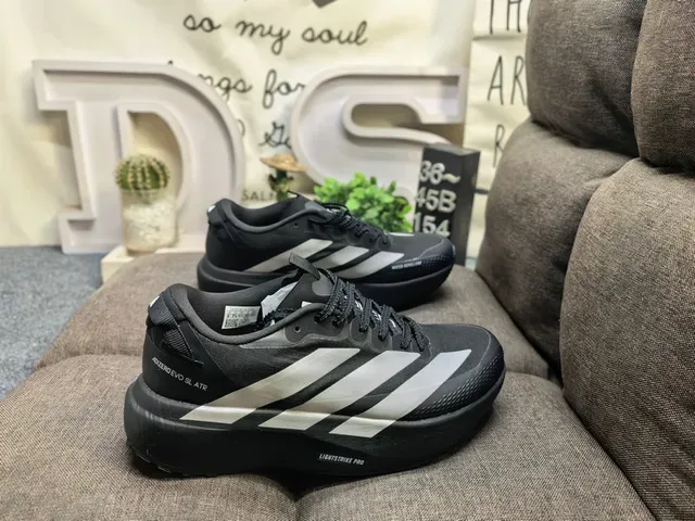 Adidas Black and Silver Three-Stripe Lifestyle Sneakers 11