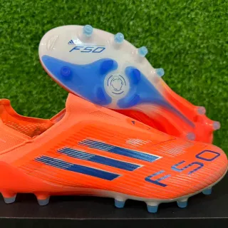 Adidas F50 नारंगी और नीली फर्म ग्राउंड फुटबॉल जूते