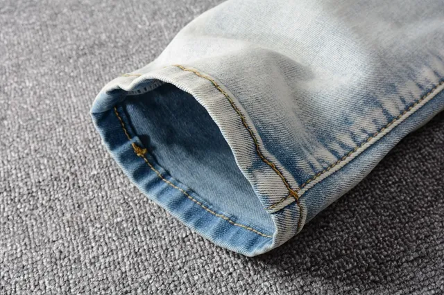 Amiri Patchwork Distressed Light-Wash Slim-Fit Jeans 11