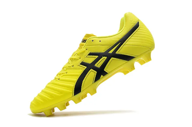ASICS Blanc Or Chaussures de football à coupe basse supérieure en synthétique superposée de rayures de tigre sur terrain ferme 24
