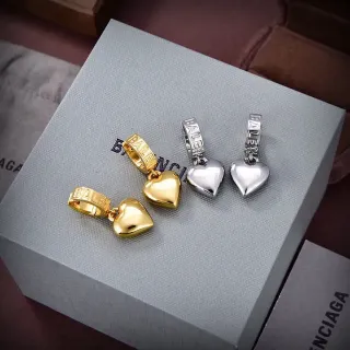 Balenciaga Pendientes charm de corazón oro y plata grabados cierre cilíndrico