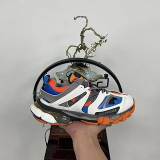 Balenciaga Sola branca laranja construção multi-painel gaiola tênis chunky