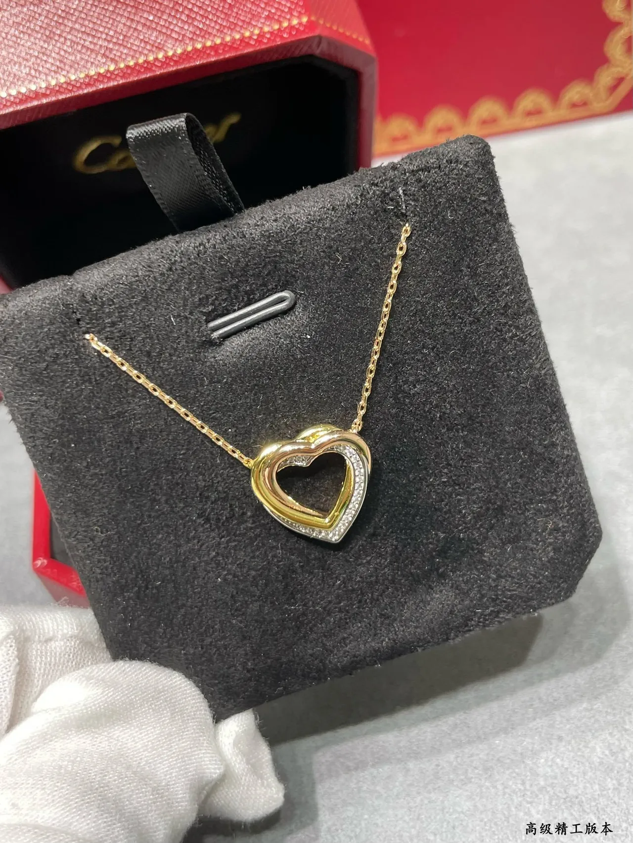 Cartier Love Collier pendentif double-cœur en or noir ajouré de deux tons 2