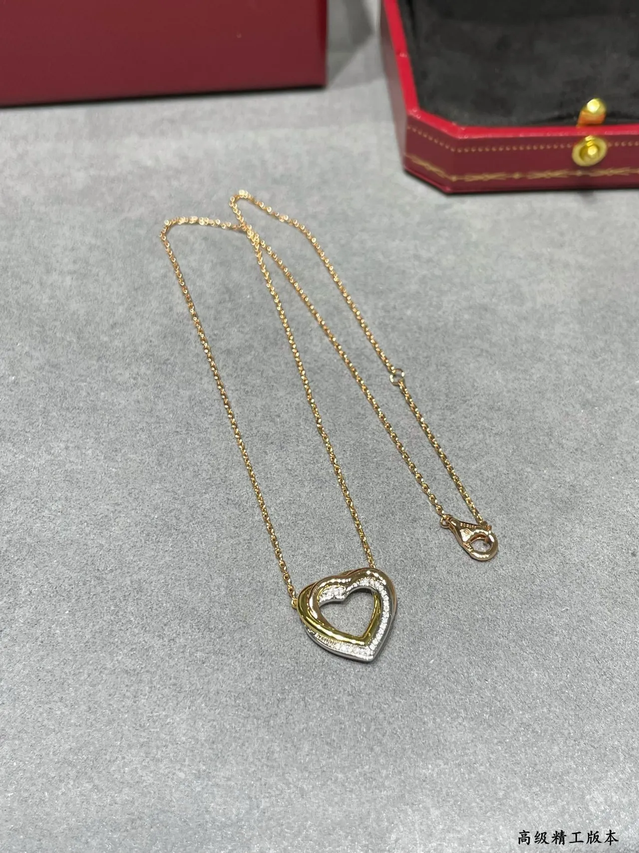 Cartier Love Collier pendentif double-cœur en or noir ajouré de deux tons 6