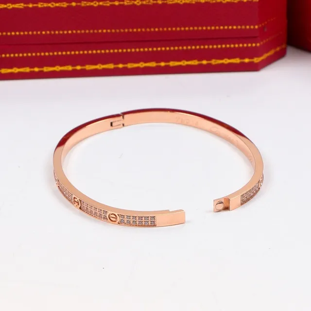 Cartier Love Bracelet à charnière en or et argent orné de pierres pavé 2