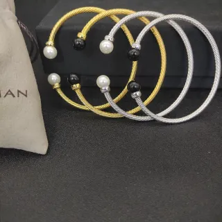 Pulsera de alambre trenzado estilo cable en oro y plata