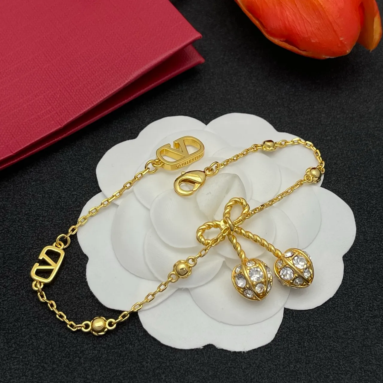 Gold-Tone Crystal Bow Charm V-Logo Chain Bracelet 7