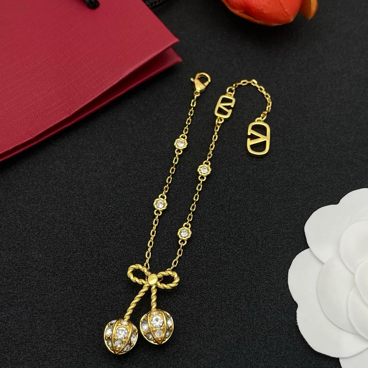 Gold-Tone Crystal Bow Charm V-Logo Chain Bracelet 8