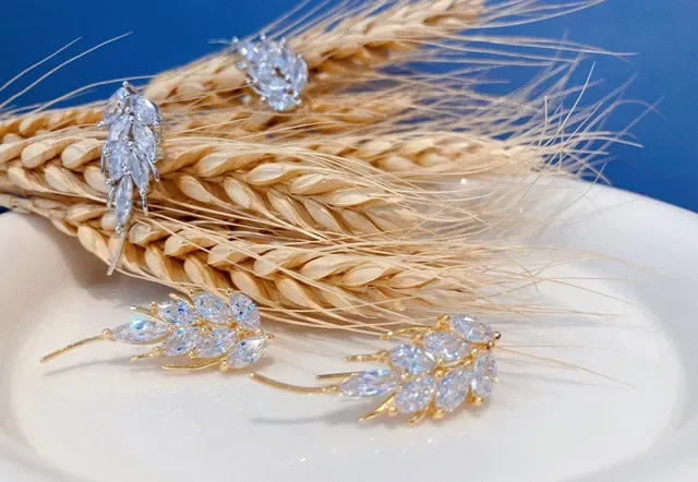 Gold-Tone Crystal Leaf Dangling Earrings 7