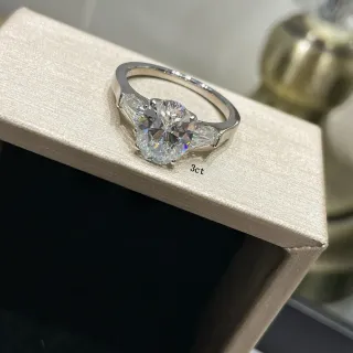 Three-Stone Round Brilliant and Tapered Baguette Diamond Ring
