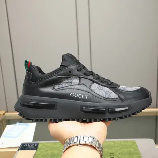 Gucci أحذية رياضية سوداء و رمادية من الجلد والقماش مع نقش GG Monogram في الأعلى، midsole Air-Unit مصقول، chunky sneakers