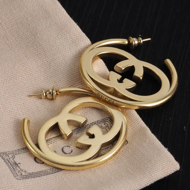 Boucles d'oreilles Gucci Double G en métal doré avec logo interlocking 2